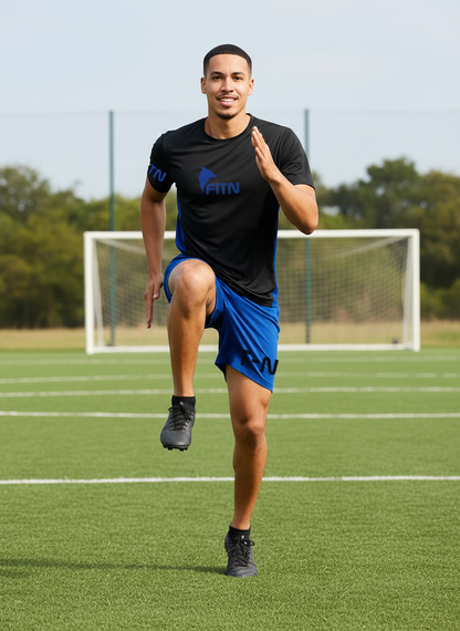 FITN Black and Blue Outfit Soccer Field Action Shot